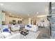 Open concept kitchen and living area with stone fireplace at 902 Sw Maynard Rd, Cary, NC 27511