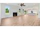 Open living room with hardwood floors and fireplace at 46 Otter Hole Dr, Princeton, NC 27569