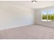Bright bedroom with carpet and large window at 46 Otter Hole Dr, Princeton, NC 27569