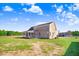 Brick house exterior with covered porch and large backyard at 46 Otter Hole Dr, Princeton, NC 27569