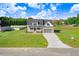 Two-story home with a front porch and gray exterior at 46 Otter Hole Dr, Princeton, NC 27569
