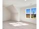 Bright bedroom with large window offering scenic views and carpeted floor at 46 Otter Hole Dr, Princeton, NC 27569