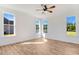 Bright bedroom with hardwood floors and large windows at 46 Otter Hole Dr, Princeton, NC 27569