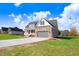 Two-story home with gray garage door and landscaping at 46 Otter Hole Dr, Princeton, NC 27569