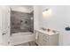 Modern bathroom with gray tile shower and soaking tub at 9 Mist Wood Court, Pittsboro, NC 27312