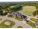 Aerial view of clubhouse with golf course in background at 9 Mist Wood Court, Pittsboro, NC 27312