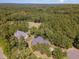 Aerial view of two homes on a wooded lot at 9 Mist Wood Court, Pittsboro, NC 27312