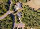 Aerial view of homes nestled in a wooded neighborhood at 9 Mist Wood Court, Pittsboro, NC 27312