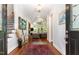 Bright entryway with hardwood floors and view of the living room at 9 Mist Wood Court, Pittsboro, NC 27312