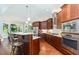 Modern kitchen with an island, stainless steel appliances, and granite countertops at 9 Mist Wood Court, Pittsboro, NC 27312