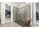 Spacious walk-in shower with glass enclosure and pebble floor at 9 Mist Wood Court, Pittsboro, NC 27312
