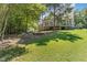 House exterior showcasing the back of house and lawn at 9 Mist Wood Court, Pittsboro, NC 27312
