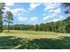 View of a lush green golf course from the property at 9 Mist Wood Court, Pittsboro, NC 27312