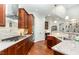 Gourmet kitchen with stainless steel appliances and granite countertops at 9 Mist Wood Court, Pittsboro, NC 27312