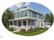 Two-story craftsman style home with front porch and attached garage at Lot C N King Ave, Dunn, NC 28334