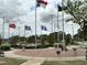 Veterans Memorial with flags and brick plaza at Lot C N King Ave, Dunn, NC 28334
