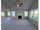 Living room with fireplace and large windows at 194 Lotus Ave, Smithfield, NC 27577
