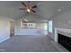 Open living room with a fireplace and kitchen views at 194 Lotus Ave, Smithfield, NC 27577