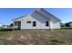 White house with covered porch, simple design, and a small yard at 194 Lotus Ave, Smithfield, NC 27577