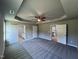 Main bedroom with carpet, two doors and access to bathroom at 194 Lotus Ave, Smithfield, NC 27577