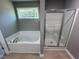 Bathroom with a shower and garden tub at 194 Lotus Ave, Smithfield, NC 27577