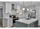 Modern kitchen with white cabinets, quartz countertops and island at 1601 Little Falls Dr, Rocky Mount, NC 27801