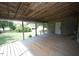 Large wooden deck with access to the front door at 495 Billy Burwell Rd, Henderson, NC 27537