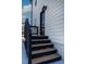 Exterior stairs leading to a private deck and entrance at 2401 E Main St, Durham, NC 27703