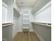 Large walk-in closet with shelves and hanging rods at 114 Shoshone Dr, Louisburg, NC 27549