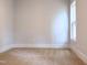 Bright bedroom with carpeted floor and large window at 114 Shoshone Dr, Louisburg, NC 27549