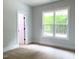 Bright bedroom with large window and carpet at 114 Shoshone Dr, Louisburg, NC 27549