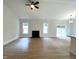 Spacious living room featuring a fireplace and ample natural light at 114 Shoshone Dr, Louisburg, NC 27549