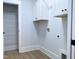 Bright laundry room with built in cabinets at 114 Shoshone Dr, Louisburg, NC 27549