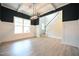 Formal dining room with dark walls, white wainscoting, and hardwood floors at 236 Abingdon Farms Dr, Selma, NC 27576