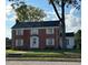 Brick two-story house with a large front yard and mature trees at 110 S Layton Avenue, Dunn, NC 28334