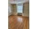 Built-in shelving and hardwood floors in this sunlit library at 110 S Layton Avenue, Dunn, NC 28334