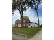 Two-story house with white and brick exterior, spacious lawn at 110 S Layton Avenue, Dunn, NC 28334