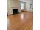 Spacious living room with hardwood floors and a fireplace at 110 S Layton Avenue, Dunn, NC 28334