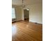 Bright dining room featuring hardwood floors and a chandelier at 110 S Layton Avenue, Dunn, NC 28334