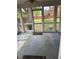 Cozy screened porch overlooking a grassy backyard at 110 S Layton Avenue, Dunn, NC 28334