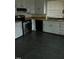Galley kitchen with white cabinets and stainless steel appliances at 110 S Layton Avenue, Dunn, NC 28334