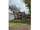 Back of the house showcasing a screened porch and patio at 110 S Layton Avenue, Dunn, NC 28334