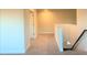 Upstairs hallway with carpet and access to bedrooms at 168 Newport Lndg, Garner, NC 27529