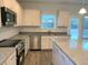 Kitchen with stainless steel appliances and granite countertops at 168 Newport Lndg, Garner, NC 27529