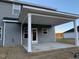 Covered patio with concrete flooring and backyard access at 168 Newport Lndg, Garner, NC 27529