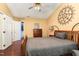 Spacious bedroom with wood floors, ceiling fan, and ample closet space at 1001 Yopon Ct, Raleigh, NC 27603