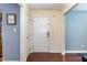 Front entry with hardwood floors and neutral colored walls at 1001 Yopon Ct, Raleigh, NC 27603