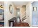 Bright entryway with hardwood floors and staircase leading upstairs at 1001 Yopon Ct, Raleigh, NC 27603