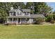 Two-story gray house with a large front yard at 1001 Yopon Ct, Raleigh, NC 27603