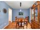 Dining room offers hardwood floors, wooden dining set and built-in hutch at 1001 Yopon Ct, Raleigh, NC 27603